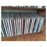 Wood CD Storage Tower Filled with CDs Wood CD Storage Tower Filled with CDs