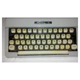 Royal Portable Typewriter And Olivetti Adding Machine.