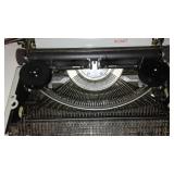 Royal Portable Typewriter And Olivetti Adding Machine.