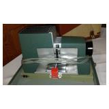 Argus 300 Slide Projector, Bell And Howell Film Projector.