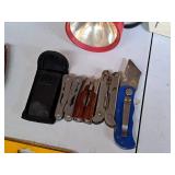 (3) Assorted Multi-Tools and (1) Utility Knife