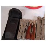 (3) Assorted Multi-Tools and (1) Utility Knife