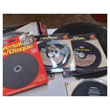 (2) 14" Steel Cut-off Blades (one new, one used), (2) 7" Cut-Off Wheel (new) and (1) 7" Universal (new)