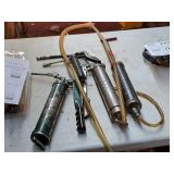 (4) Grease Guns and (1) Pump