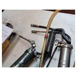 (4) Grease Guns and (1) Pump