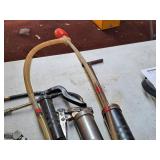 (4) Grease Guns and (1) Pump