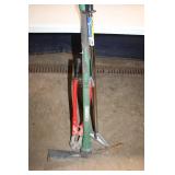 Group of Hand Tools Including Pickaxe, Bolt Cutters, and Post Driver