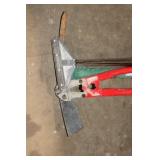 Group of Hand Tools Including Pickaxe, Bolt Cutters, and Post Driver