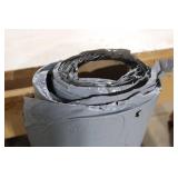 Partial Roll of Black and Gray Vinyl Sheet Material