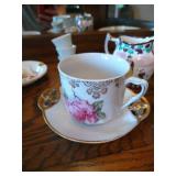 Shelf of Misc. China Tea Cups, Cream & Sugar Bowls, Etc Shelf of Misc. China Tea Cups, Cream & Sugar Bowls, Etc