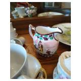 Shelf of Misc. China Tea Cups, Cream & Sugar Bowls, Etc Shelf of Misc. China Tea Cups, Cream & Sugar Bowls, Etc