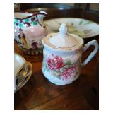 Shelf of Misc. China Tea Cups, Cream & Sugar Bowls, Etc Shelf of Misc. China Tea Cups, Cream & Sugar Bowls, Etc