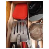 Drawer of Kitchen Tools: Spatulas, Tongs, Scrapers, Etc