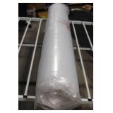 Unopened Rolled Mattress in Plastic Packaging