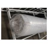 Unopened Rolled Mattress in Plastic Packaging