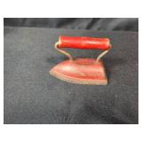 Vintage Toy Collection with Teddy Bear, Mini Washboard, Red Iron, and Folk Spinner