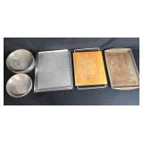 Collection of Baking Sheets, Round Cake Pans, and Wood Cutting Board Collection of Baking Sheets, Round Cake Pans, and Wood Cutting Board