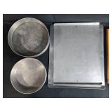 Collection of Baking Sheets, Round Cake Pans, and Wood Cutting Board Collection of Baking Sheets, Round Cake Pans, and Wood Cutting Board