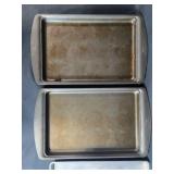 Collection of Baking Sheets, Round Cake Pans, and Wood Cutting Board Collection of Baking Sheets, Round Cake Pans, and Wood Cutting Board