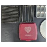 Collection of Bakeware Trays, Cooling Racks, Madeleine Pans, and Pizza Tray Collection of Bakeware Trays, Cooling Racks, Madeleine Pans, and Pizza Tray