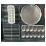 Collection of Bakeware Trays, Cooling Racks, Madeleine Pans, and Pizza Tray Collection of Bakeware Trays, Cooling Racks, Madeleine Pans, and Pizza Tray