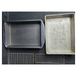 Collection of Bakeware Trays, Cooling Racks, Madeleine Pans, and Pizza Tray Collection of Bakeware Trays, Cooling Racks, Madeleine Pans, and Pizza Tray