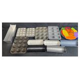 Collection of Bakeware and Decorative Plates Including Muffin Pans, Loaf Pans, Pizza Pan, and Fruit Plate Collection of Bakeware and Decorative Plates Including Muffin Pans, Loaf Pans, Pizza Pan, and Fruit Plate