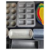 Collection of Bakeware and Decorative Plates Including Muffin Pans, Loaf Pans, Pizza Pan, and Fruit Plate Collection of Bakeware and Decorative Plates Including Muffin Pans, Loaf Pans, Pizza Pan, and Fruit Plate