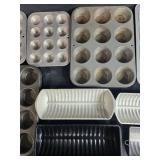 Collection of Bakeware and Decorative Plates Including Muffin Pans, Loaf Pans, Pizza Pan, and Fruit Plate Collection of Bakeware and Decorative Plates Including Muffin Pans, Loaf Pans, Pizza Pan, and Fruit Plate