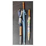 Group of Assorted Vintage and Patterned Umbrellas with Wooden Handles Group of Assorted Vintage and Patterned Umbrellas with Wooden Handles