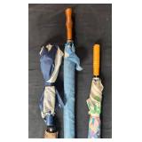 Group of Assorted Vintage and Patterned Umbrellas with Wooden Handles Group of Assorted Vintage and Patterned Umbrellas with Wooden Handles