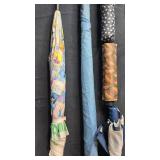 Group of Assorted Vintage and Patterned Umbrellas with Wooden Handles Group of Assorted Vintage and Patterned Umbrellas with Wooden Handles