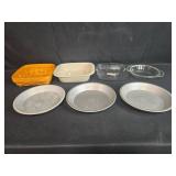 Assorted Bakeware Lot with Pie Pans, Casserole Dishes, and Woven Basket Assorted Bakeware Lot with Pie Pans, Casserole Dishes, and Woven Basket