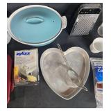 Assorted Kitchenware Lot with Bakeware, Grater, Coffee Filters, and Tableware Assorted Kitchenware Lot with Bakeware, Grater, Coffee Filters, and Tableware