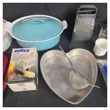 Assorted Kitchenware Lot with Bakeware, Grater, Coffee Filters, and Tableware Assorted Kitchenware Lot with Bakeware, Grater, Coffee Filters, and Tableware
