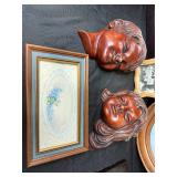 Collection of Framed Artworks and Wall Decor Including Carved Faces and Floral Prints Collection of Framed Artworks and Wall Decor Including Carved Faces and Floral Prints