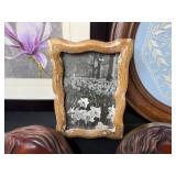 Collection of Framed Artworks and Wall Decor Including Carved Faces and Floral Prints Collection of Framed Artworks and Wall Decor Including Carved Faces and Floral Prints