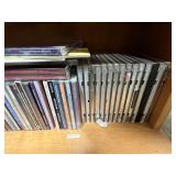 Collection of Music CDs on Wood Bookshelf (inc) Collection of Music CDs on Wood Bookshelf (inc)