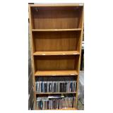 Collection of Music CDs on Wood Bookshelf (inc) Collection of Music CDs on Wood Bookshelf (inc)
