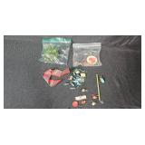 Assorted Holiday Decor Lot with Red Towels, Garland, and Figurines Assorted Holiday Decor Lot with Red Towels, Garland, and Figurines