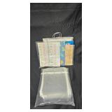 Collection of Framed Artwork, Sheet Protectors, Paper Bags, and Decorative Paper Collection of Framed Artwork, Sheet Protectors, Paper Bags, and Decorative Paper