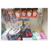 Paper Bags, pool mat, card games, kids workbooks, cornhole, rubber snakes, flash cards, wallets, foot pumps