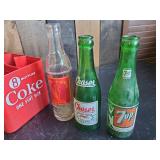 Collectible Plastic Coke Crate with Handle and Various Vintage Soda Bottles