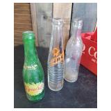 Collectible Plastic Coke Crate with Handle and Various Vintage Soda Bottles