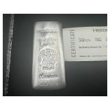 Heraeus Ten Ounce .9999 Silver Bar with Certificate of Authenticity Serial No. JA97575 Heraeus Ten Ounce .9999 Silver Bar with Certificate of Authenticity Serial No. JA97575
