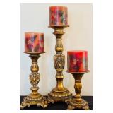 Three-Tiered Gold Patina Candleholders and Red Candles