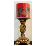Three-Tiered Gold Patina Candleholders and Red Candles