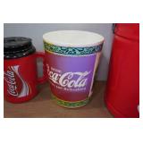 Coca-Cola Collectibles - Tins, Travel Mug, Garbage Bin Coca-Cola Collectibles - Tins, Travel Mug, Garbage Bin