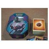 Assorted Pokemon Cards and Tin Assorted Pokemon Cards and Tin