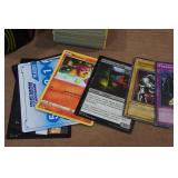 Assorted Pokemon Cards and Tin Assorted Pokemon Cards and Tin